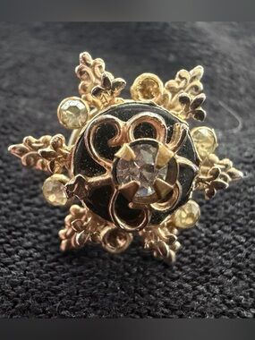 Vintage-style gold-tone snowflake pin